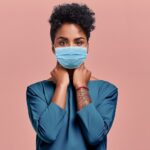 Woman responsibly uses mask during COVID pandemic