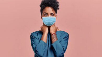 Woman responsibly uses mask during COVID pandemic