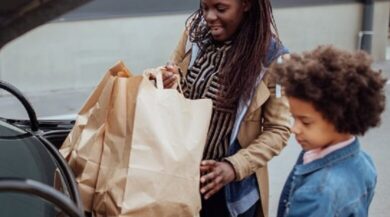 Mother and daughters grocery shopping