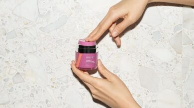 Vella Bioscience woman Holding Bottle